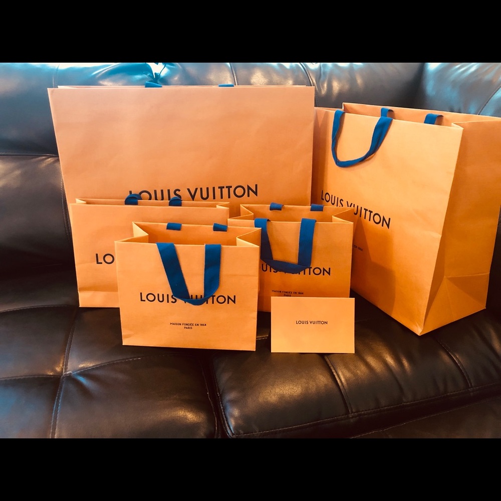 Louis Vuitton shopping bags .
